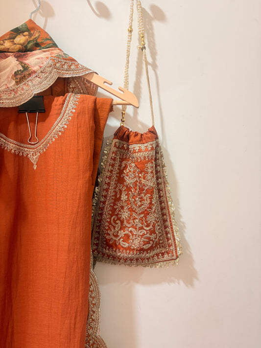 IdaraDesignsxHomake Mul Cotton Suit with embroidery and a Beautiful Matching Potli ( Rust Color, 4 Pc)